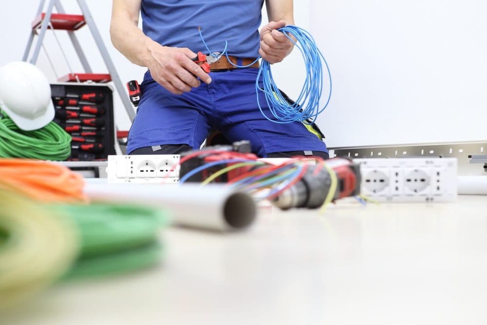 A Gold Medal technician cutting wire