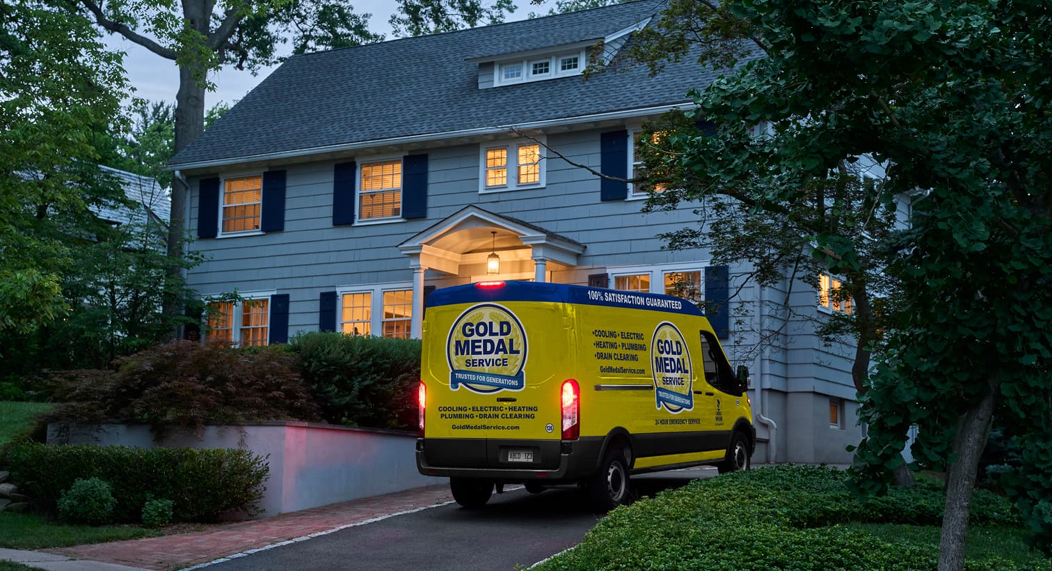 Gold Medal technician arriving at a home in the evening to provide emergency plumbing services.
