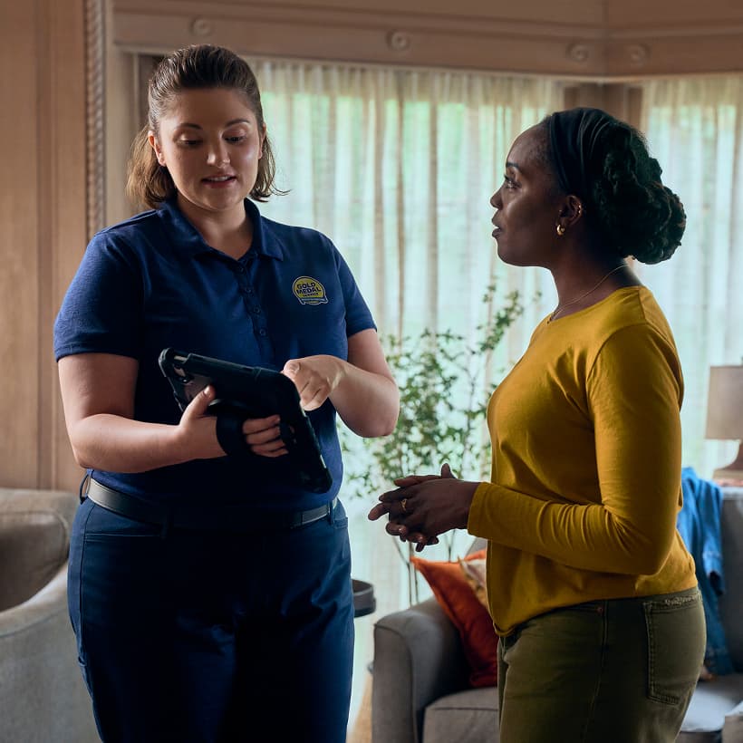 A Gold Medal Comfort Advisor discuss our Comfort360 Membership benefits with a homeowner.