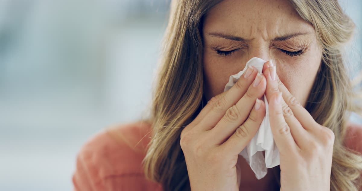 Woman Blowing Nose