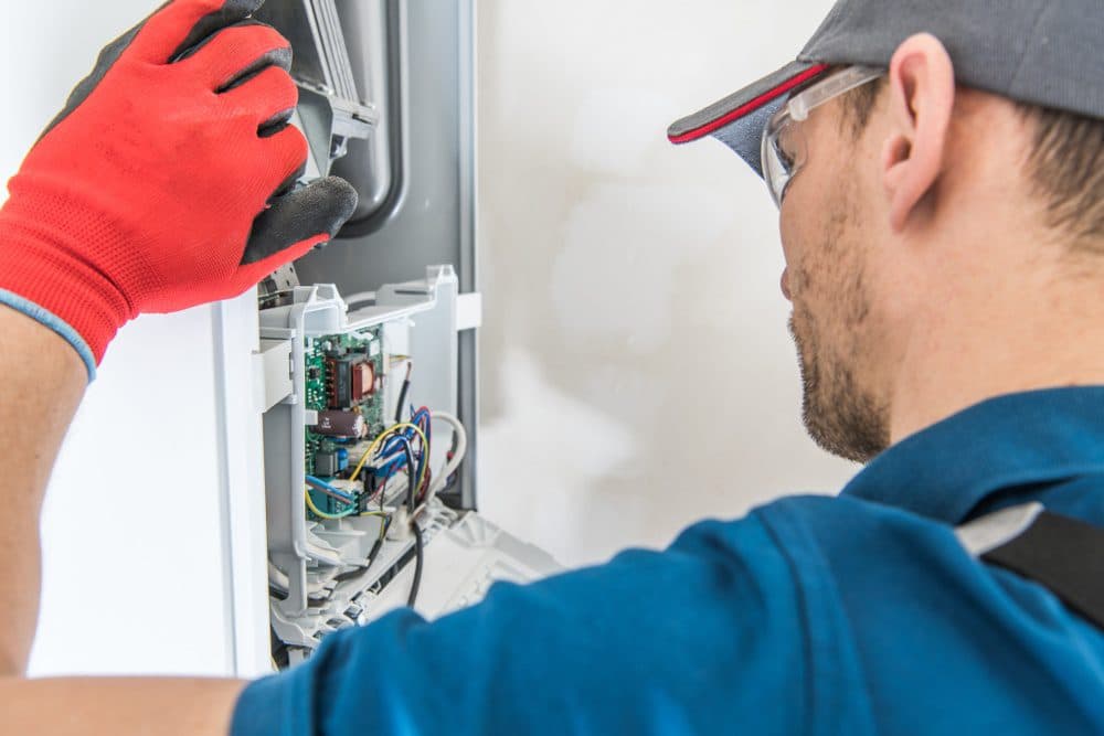 A Gold Medal technician replacing a furnace