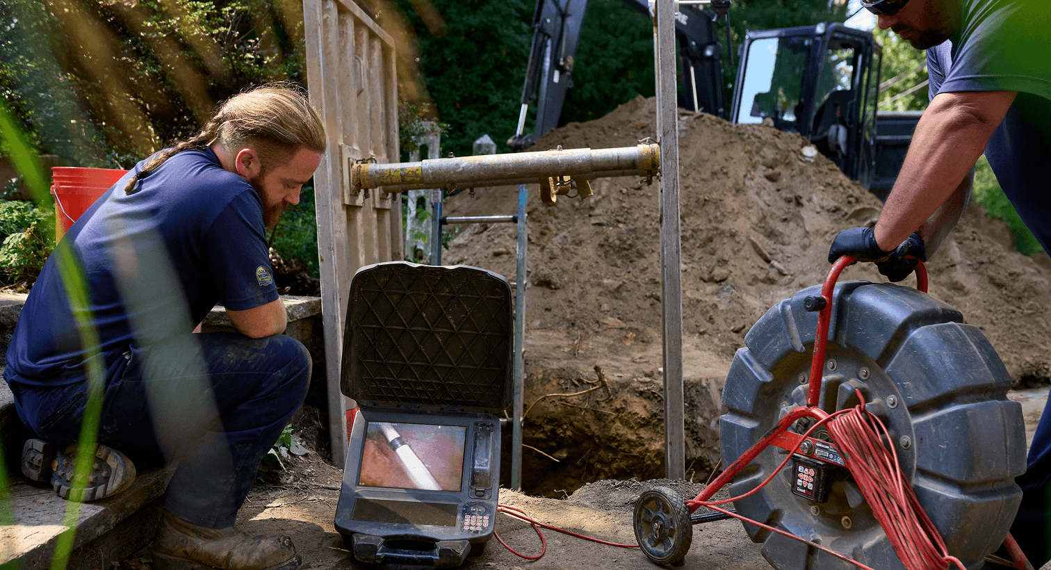Technicians working on sewer services