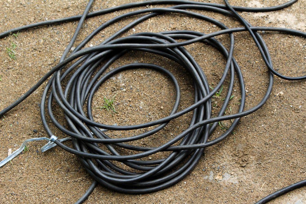 Messy spool of black wires